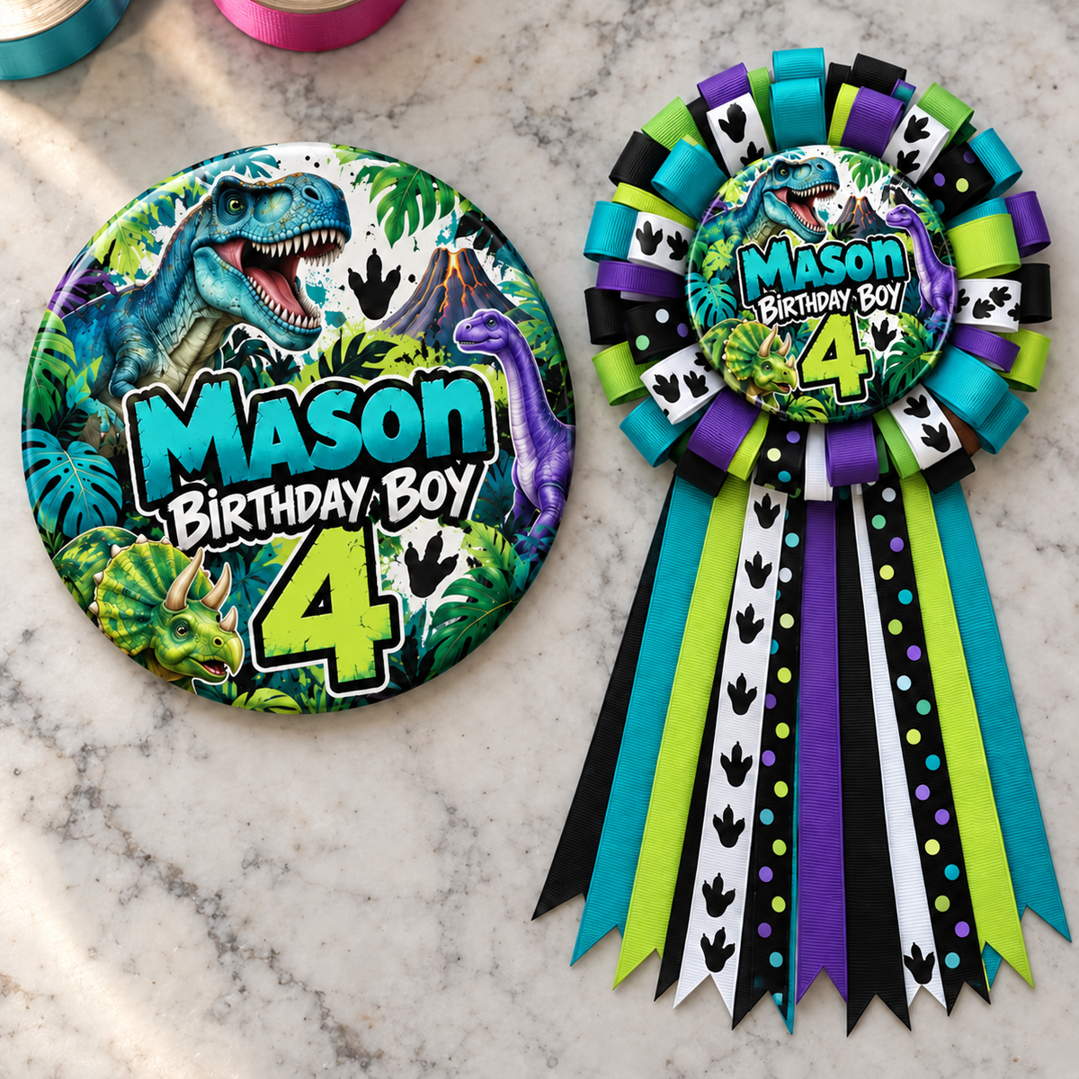 dinosaur themed personalized birthday button and ribbon mum displayed on a marble tabletop